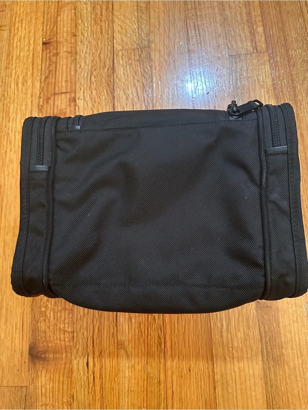 Tumi  hanging travel kit  with hook for hanging.